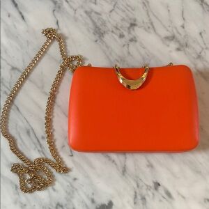 Urban Expressions Vibrant Orange Clutch with Gold Chain